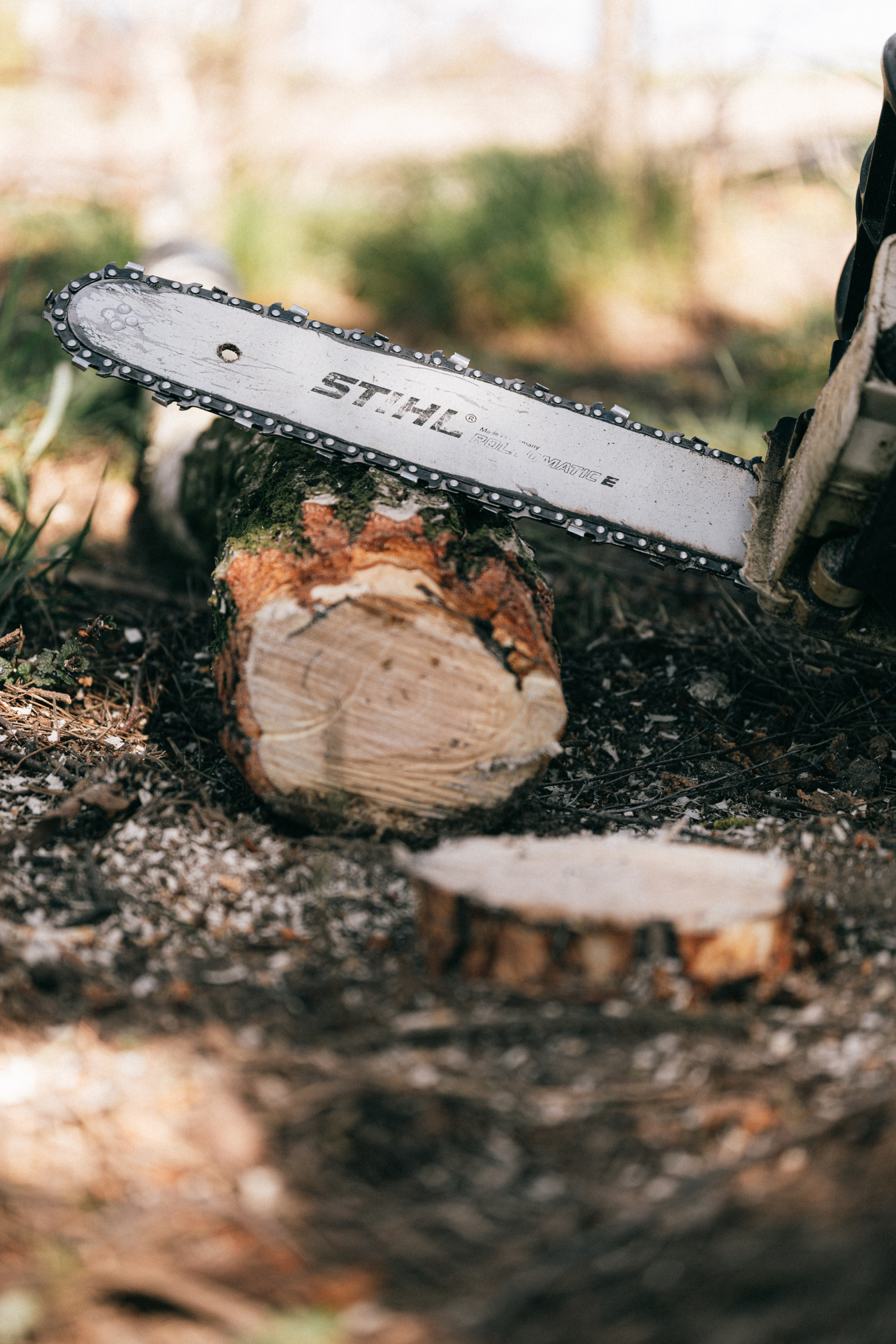 Photo of Chainsaw on Wooden Log